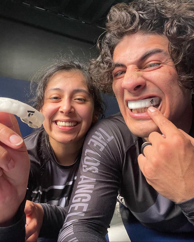 Brazilian jiu-jitsu athletes wearing mouthguards