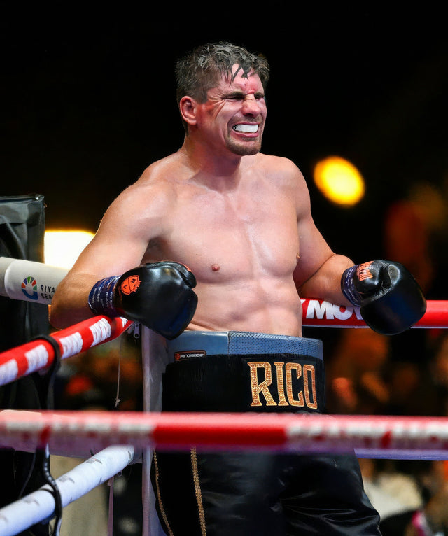 Professional boxer wearing a mouthguard between rounds