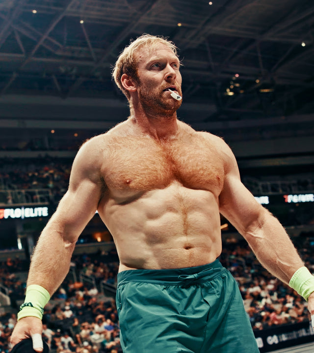 Functional fitness athlete wearing a mouthpiece after competition