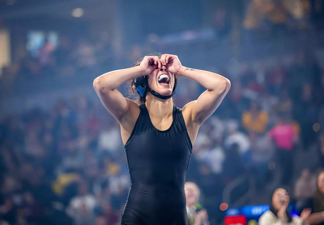 Wrestlers competing on the mat